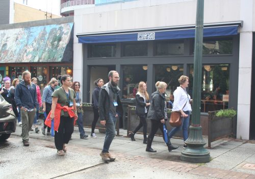 People walking through downtown asheville